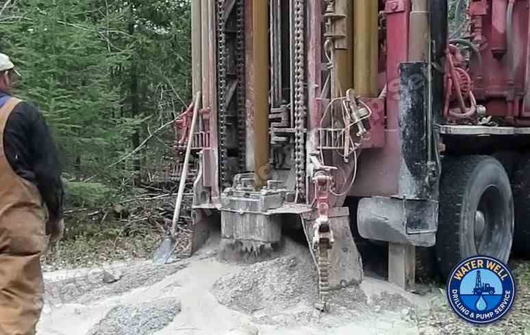 Drilling rig working through bedrock in Oakland Hills to install residential water well