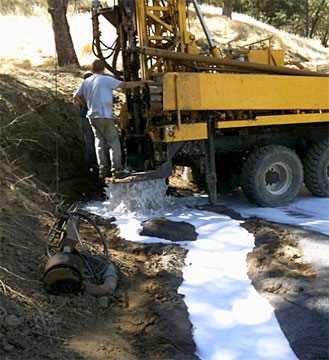 Technician operating a water well drilling truck in the San Francisco Bay Area, Northern California
