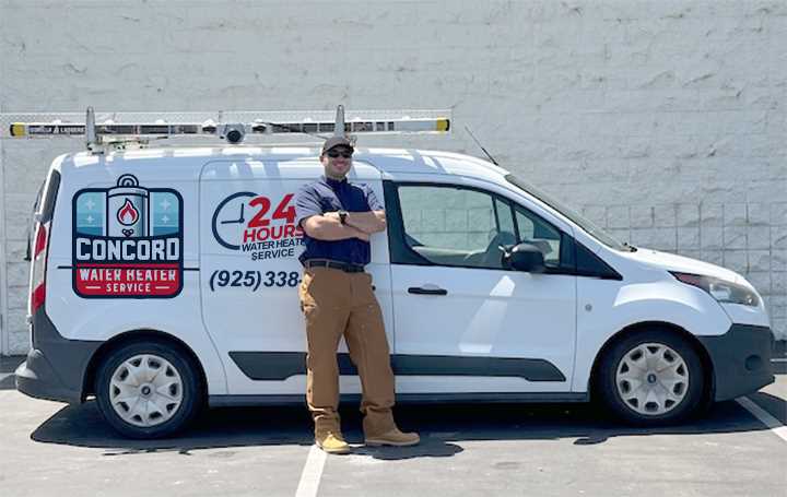 Well water heating specialist from Concord Water Heater Service standing beside company van